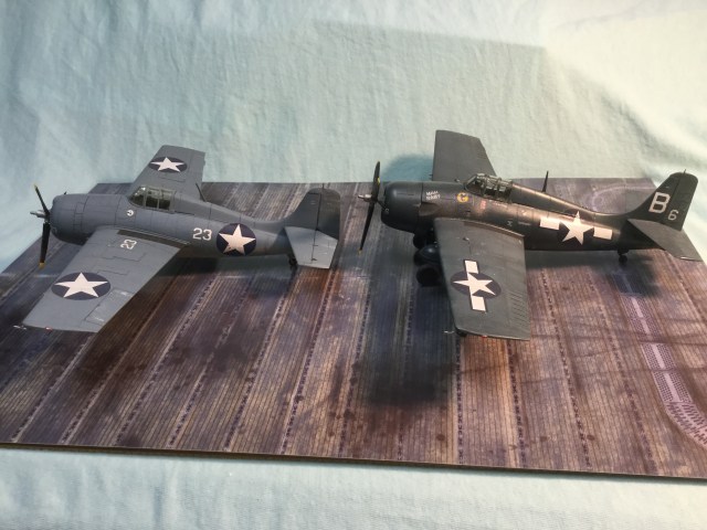 An earlier F4F-4 Wildcat on the left. The FM-2 had a taller tail to counteract greater engine torque. The cockpit should sit a little taller, I don't believe is properly represented by the kit. And the nose should be a little blunter on the FM-2.