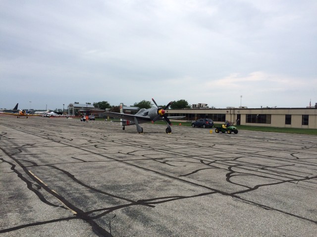 Fw190. Or a very close approximation... This is another type I saw fly for the first time today. But I could not find any information on exactly what it was. Looks like a Fw190A-9/N, sort of. But the cowling and propeller are different. Google was no help.