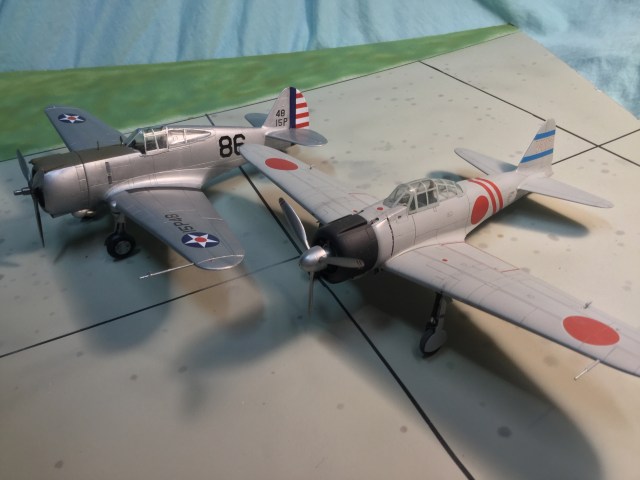 The P-36 and its rival on December 7. The Zero was a more advanced design, but by as much as many suppose. The P-36 was mainly handicapped by the surprise attack and some disparity in pilot skill levels.